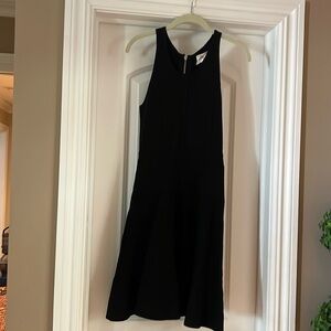Beautiful quality black dress.  Sleeveless, flattering waistline, swing skirt.
